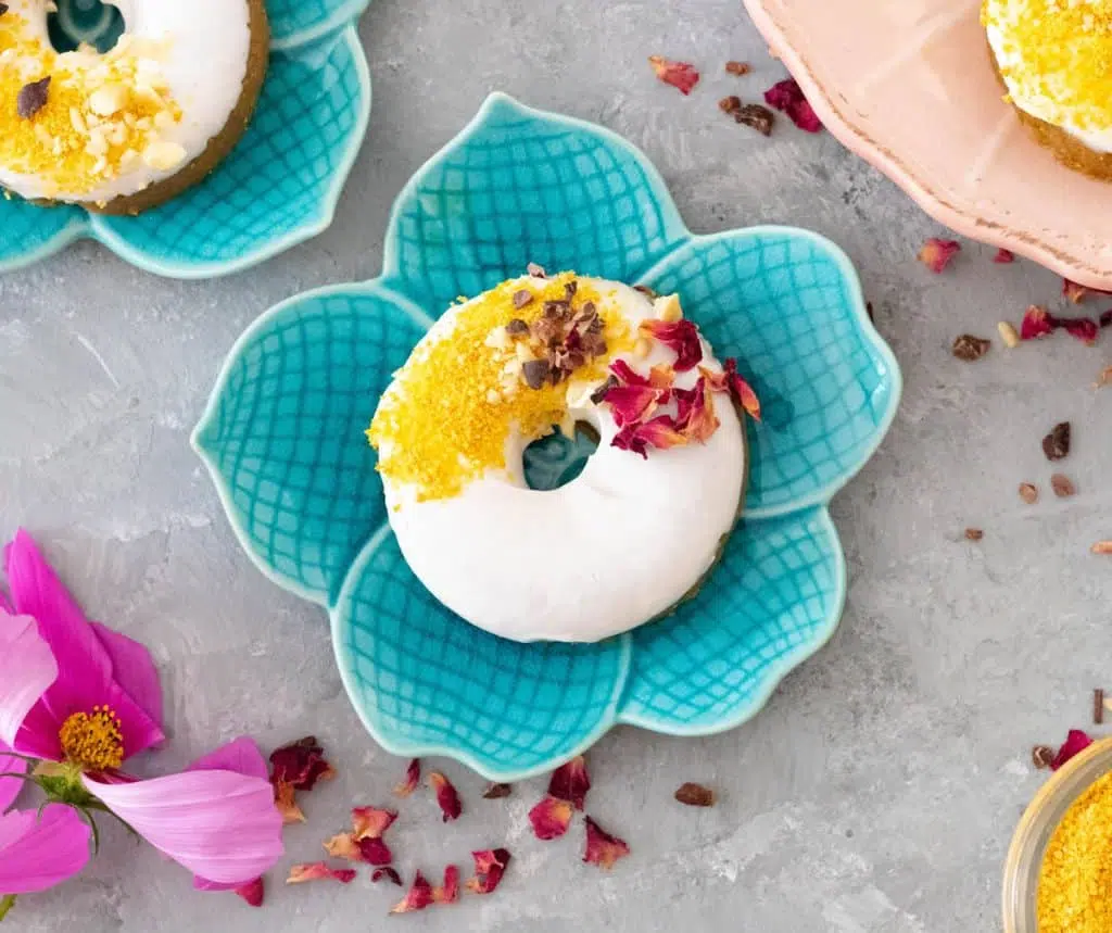 Raw doughnut on a blue plate