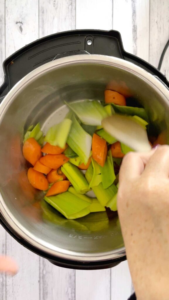 Stirring the veg in the chicken soup