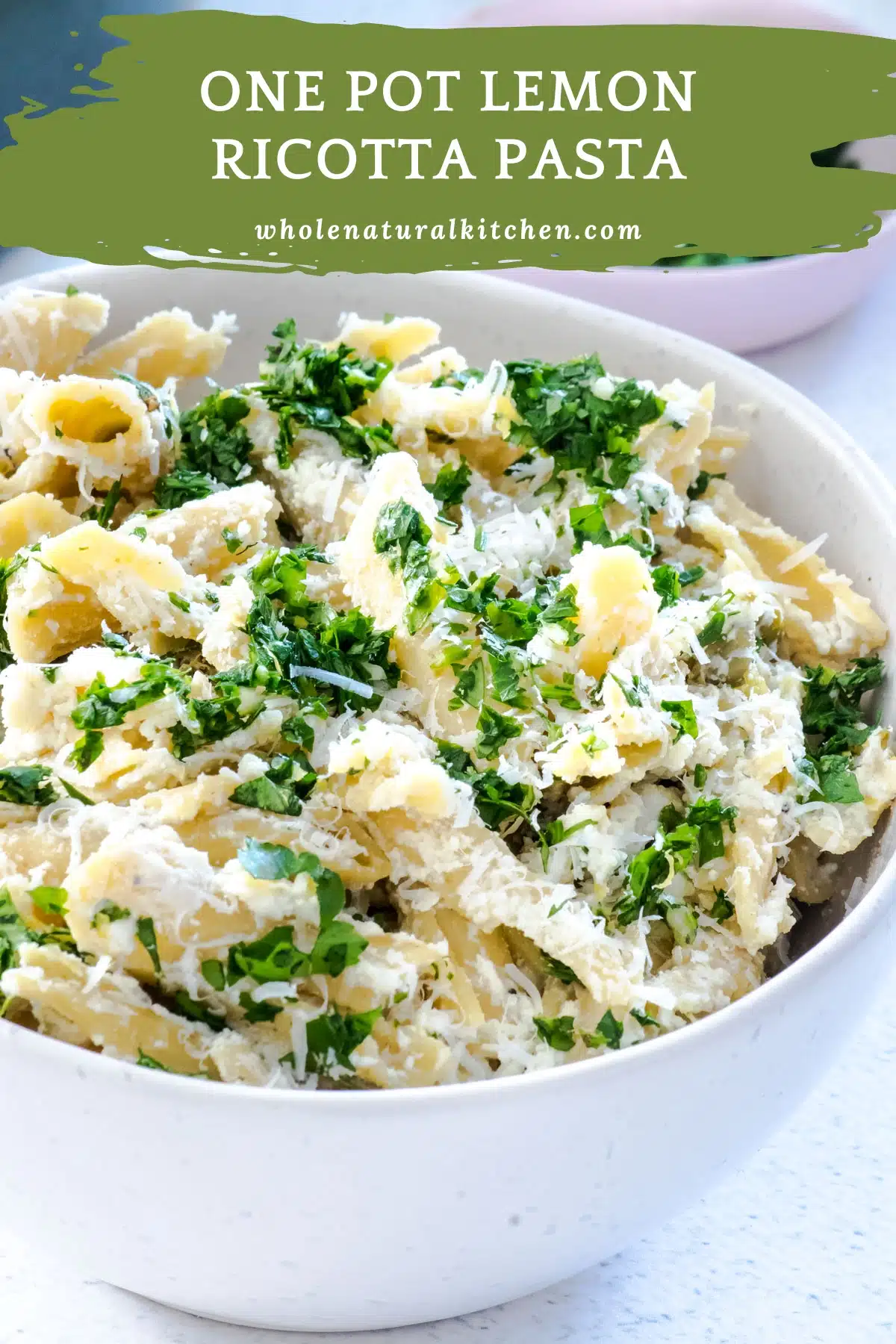 A Pinterest poster image showing the name of the recipe and the website name at the top on a green background, along with a bowl of the one pot lemon ricotta pasta sitting on a white table.