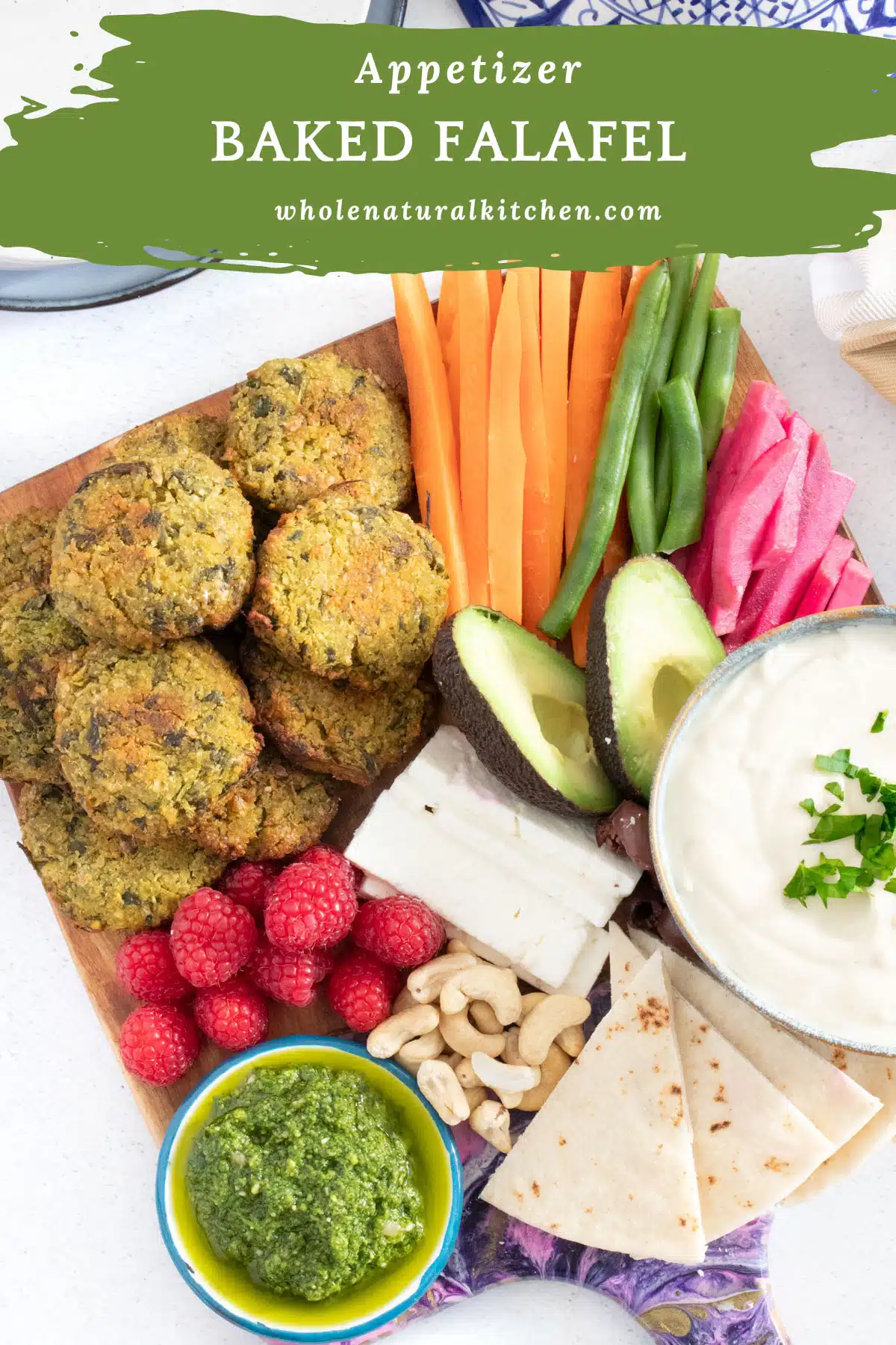 A pinterest poster image showing the name of the recipe up the top along with the website and course. An image of falafel as part of a colourful mezze board is down the bottom.
