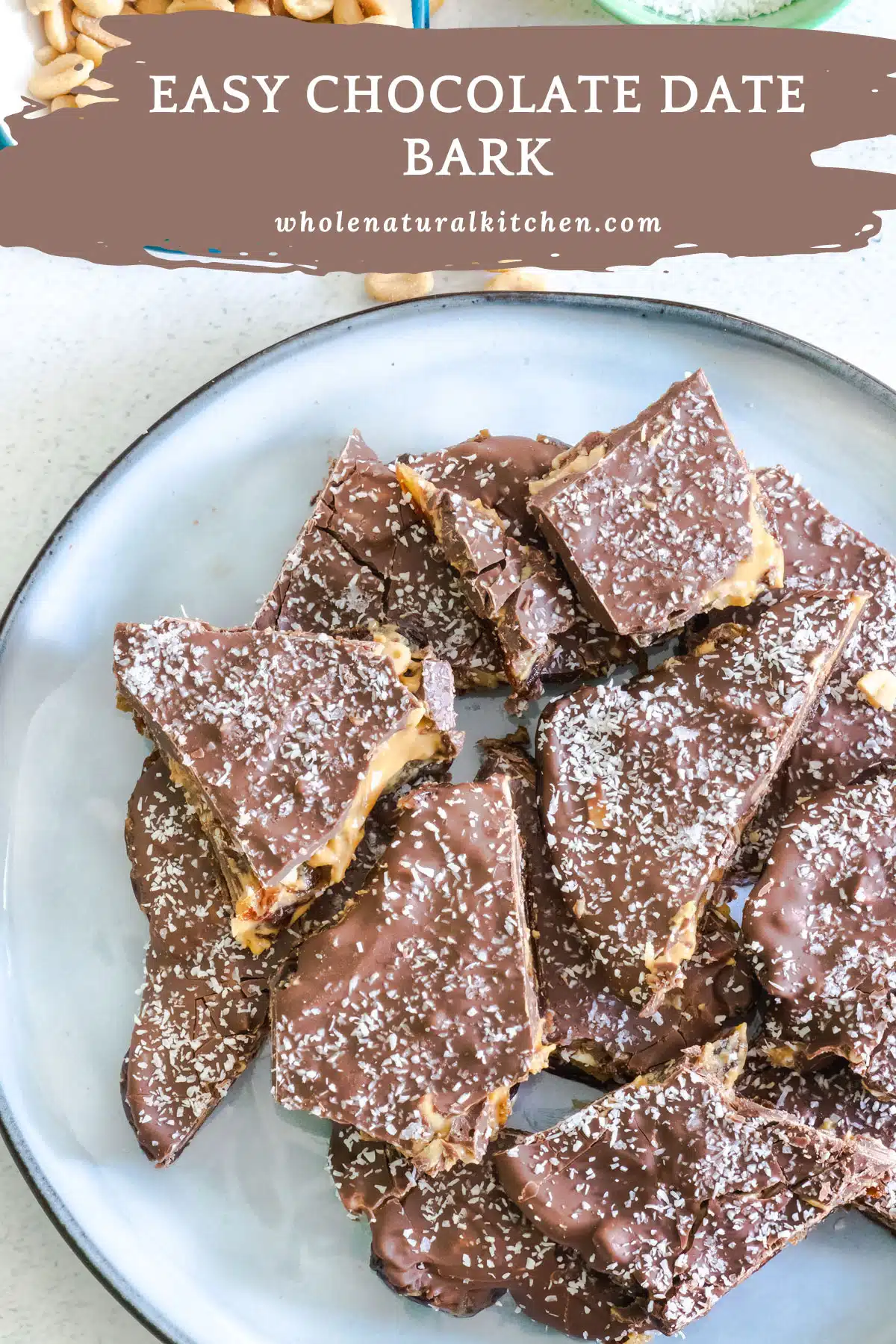 A Pinterest poster image showing the name of the recipe and the website up the top. Below is a blue plate filled with cut pieces of chocolate date bark.