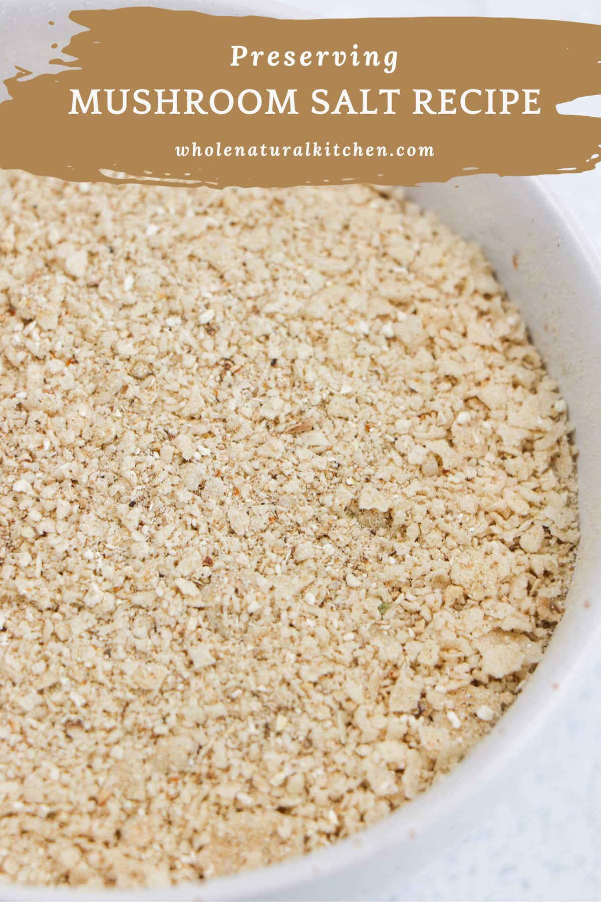 A Pinterest Poster showing the name of the recipe and the website at the top and the mushroom salt in a bowl underneath.