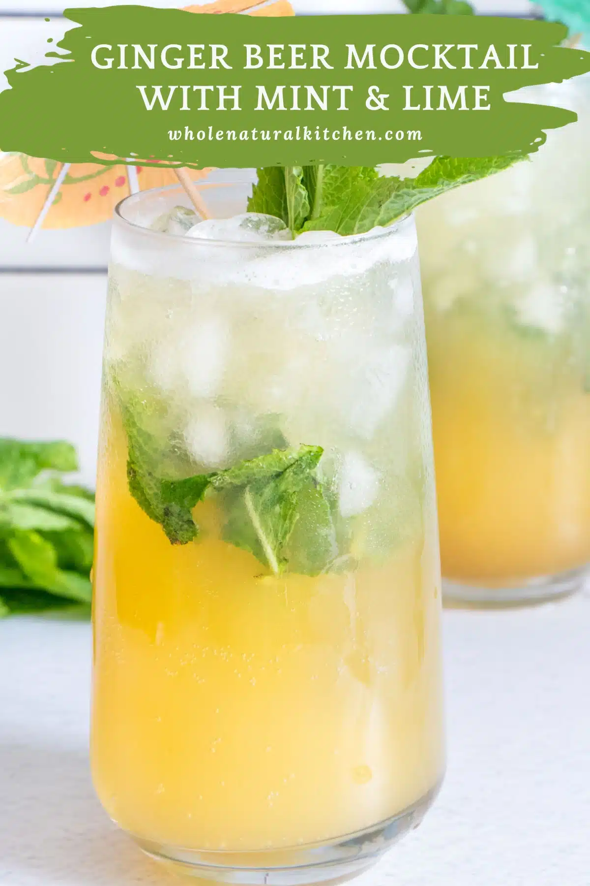 A pinterest poster image showing the name of the recipe and website at the top with a ginger beer mocktail underneath.